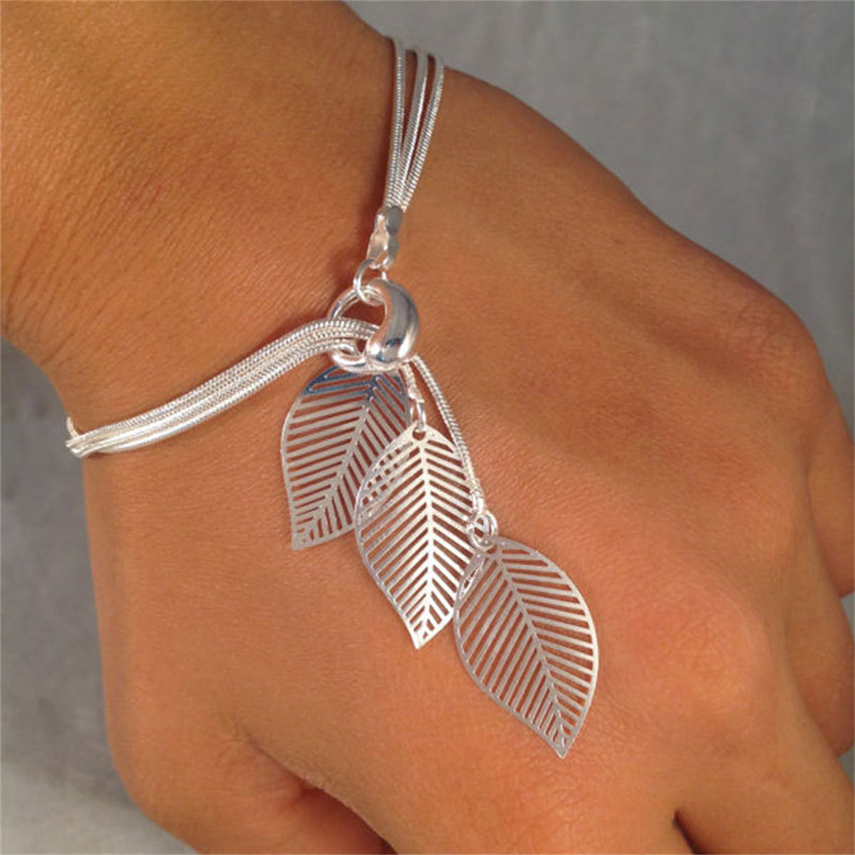 Silver-Plated Leaves Strand Charm Bracelet, silver bracelet for women, dainty minimalist design, front view