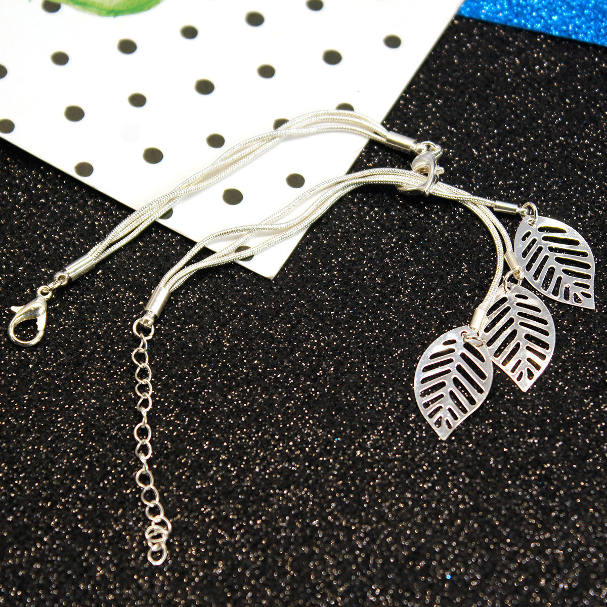 Silver-Plated Leaves Strand Charm Bracelet, silver bracelet for women, dainty minimalist design, lifestyle look