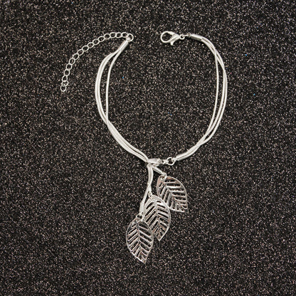 Silver-Plated Leaves Strand Charm Bracelet, silver bracelet for women, dainty minimalist design, styled look