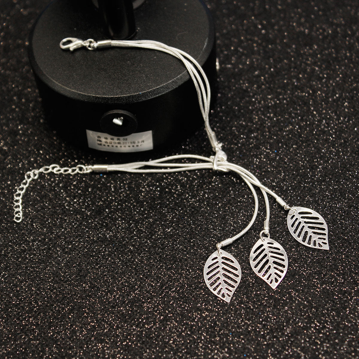 Silver-Plated Leaves Strand Charm Bracelet, silver bracelet for women, dainty minimalist design, side view