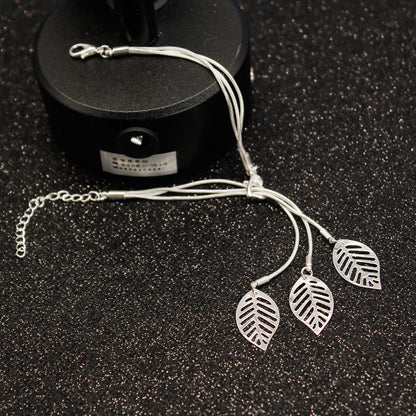Silver-Plated Leaves Strand Charm Bracelet, silver bracelet for women, dainty minimalist design, side view