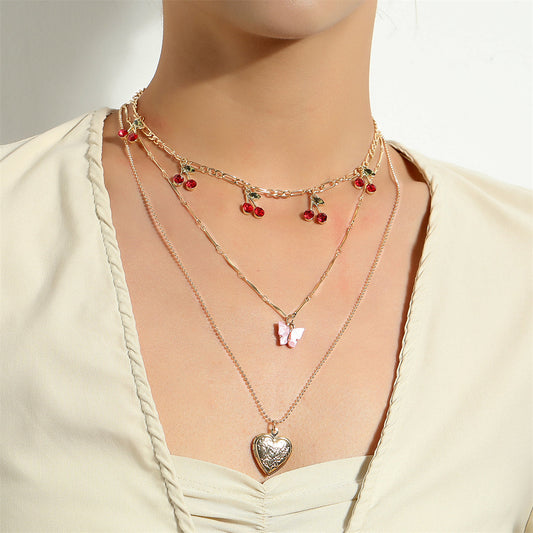 Red Cubic Zirconia and Acrylic Cherry Butterfly Heart Locket Necklace Set, jewelry gift sets for women, front view