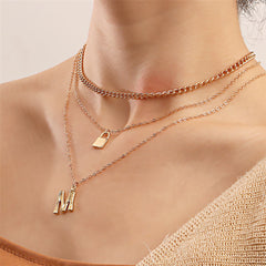 Beautiful 18K gold-plated necklace showcasing a stylish 'M' lock pendant and key, ideal for elevating your jewelry collection.