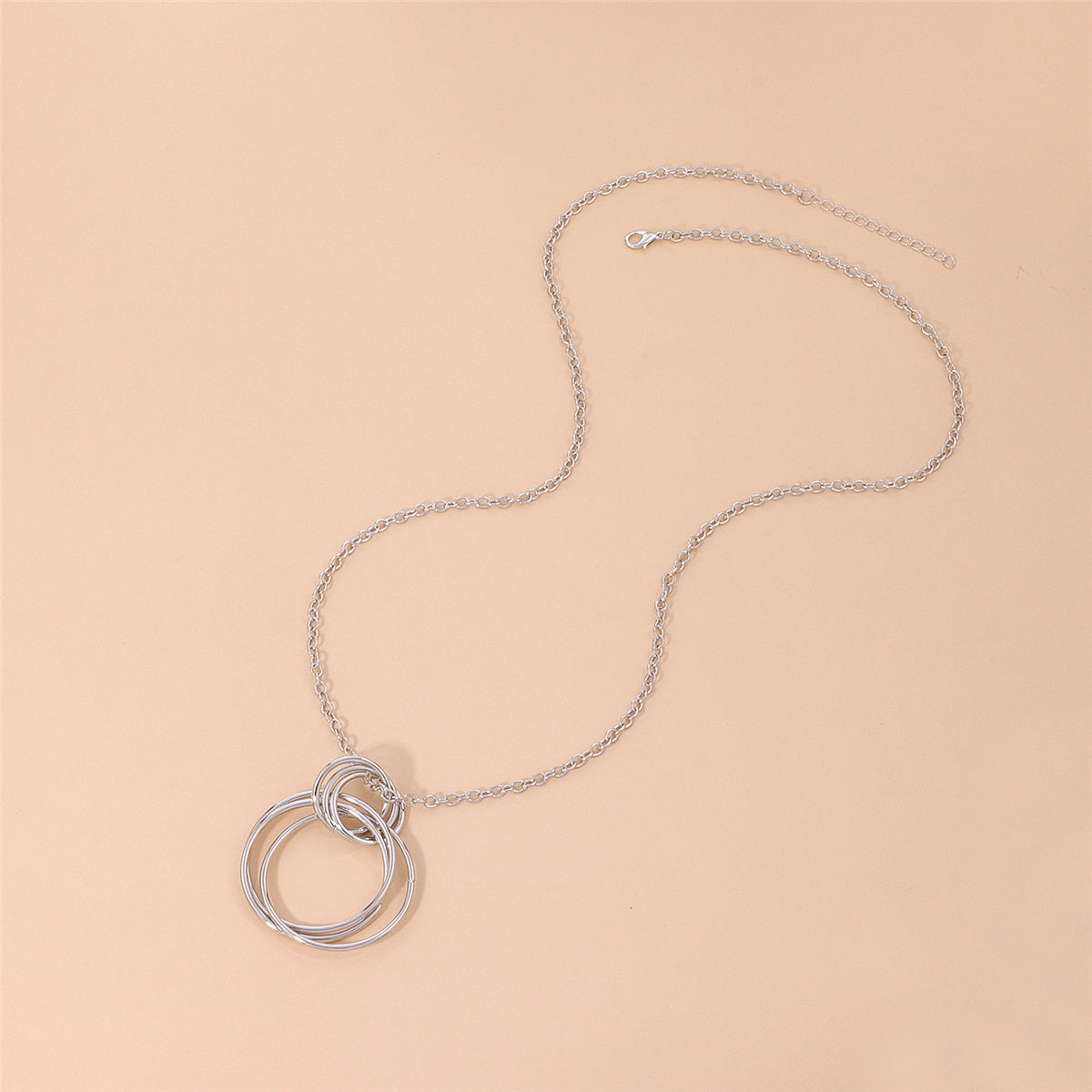 Silver-Plated Interlocked Circle Pendant Necklace, silver pendant necklace for women, everyday style, detail close-up