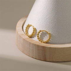 Chic 18k gold ball hoop earrings, a must-have accessory for a fashionable and polished look.