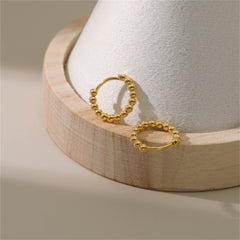 Beautiful 18k gold ball hoop earrings, designed to enhance your jewelry collection with their classic appeal.