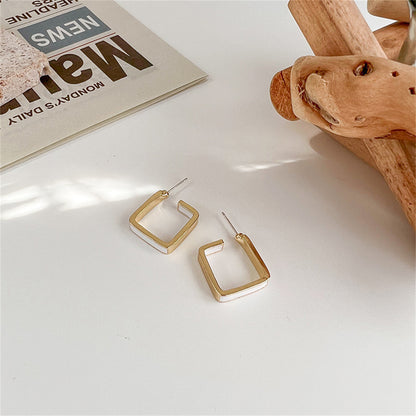 White Enamel and 18K Gold-Plated Open Square Huggie Earring, gold huggie earrings, everyday style, side view