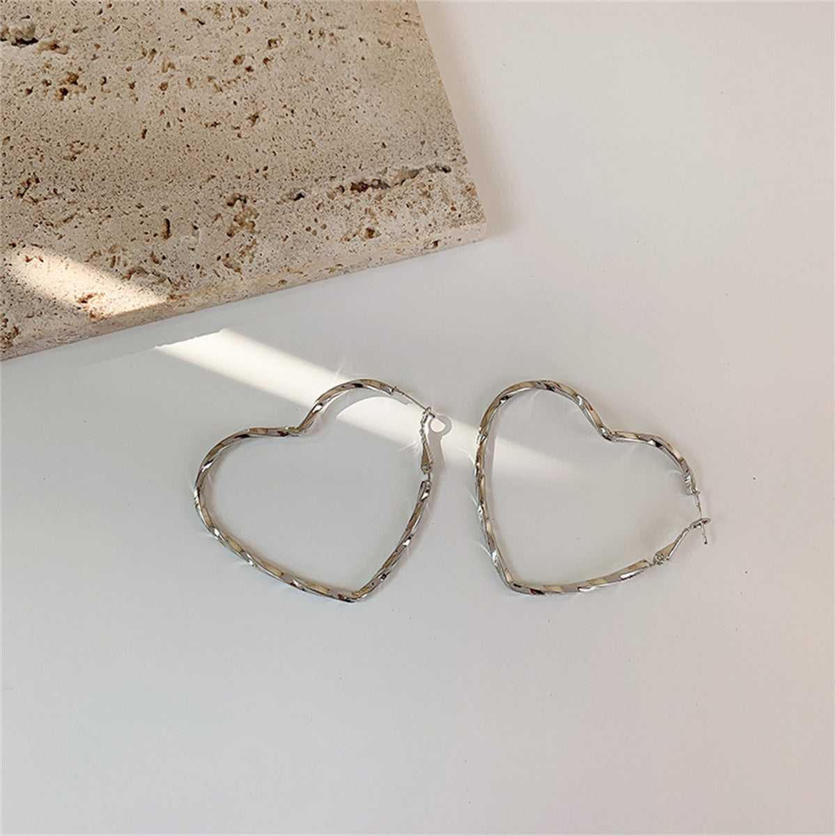 Silver-Plated Twisted Heart Hoop Earrings, botanical inspired, side view